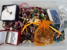 A box containing a quantity of costume jewellery some stamped 925, vintage beads and similar.