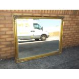 A large good quality bevel edged ornately framed wall mirror approx 103cm x 131cm