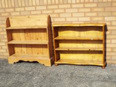Two pine bookcases, the larger being approximately 88 cm x 86 cm x 20.5 cm.