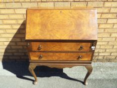 A writing bureau with two drawers approx 101cm x 81cm x 45cm