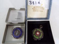 A silver and enamelled 1929 nursing meda