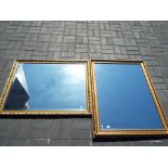 Two large bevel edged framed wall mirror