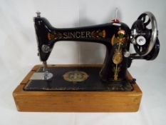 A decorative vintage Singer Sewing Machi