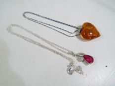 Two silver necklaces with pendants. Esti