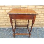 A good quality oak occasional table on b