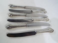 Six silver handled knives marked Rostfre