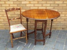 A mahogany gate leg table on barley twist supports height 75cm also includes a bedroom chair This