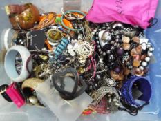 A box of mixed costume jewellery to include necklaces, earrings, bangles and similar,