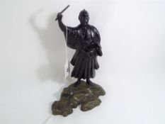 An Oriental hand-painted cast figure depicting a Samurai warrior, approximate height 24 cm (h).