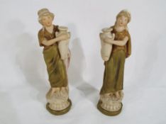 Royal Dux - Two small Royal Dux Water Carrier figurines depicting ladies in classical dress,