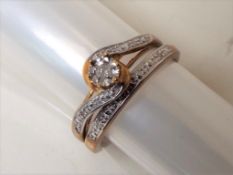 A lady's 9 carat gold diamond set two-piece twin set ring, approx 2.