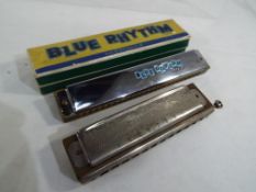 A M Hohner - A Super Chromonica harmonica by M. Hohner and a Blue Rhythm harmonica in original box.