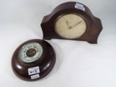 An oak cased Smiths eight day mantel clock with floating balance and wind up movement,