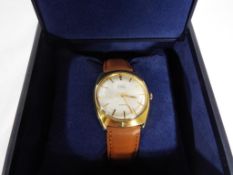 A gentleman's Avia Olympic 17 jewel wristwatch with leather strap, in associated box.