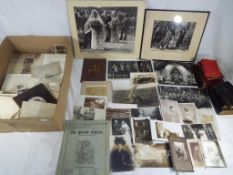 A large quantity of vintage black and white photographs to include family photographs,
