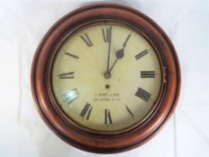 An early 20th century 12" dial or school clock, turned mahogany surround, brass bezel,