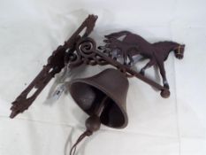 A cast iron wall hanging bell Est £20 - £30 This lot MUST be paid for and collected,
