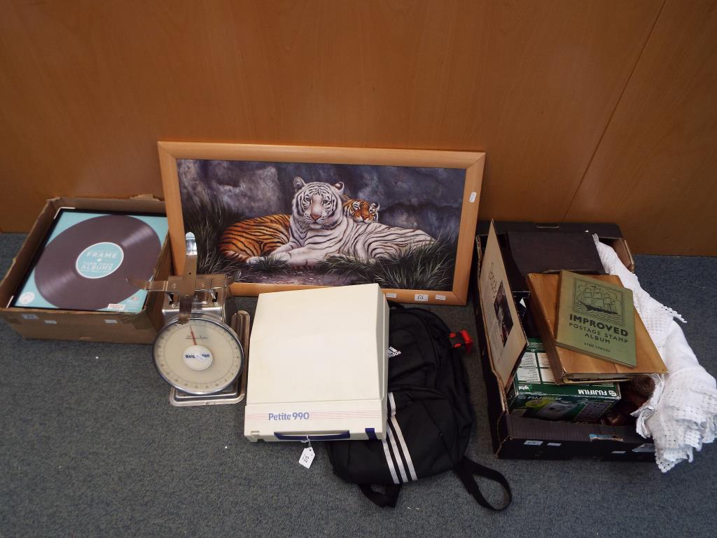 A good mixed lot to include linen, two stamp albums, a small wooden storage box,