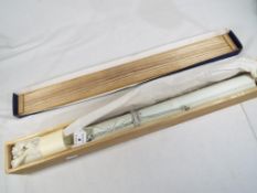 A Japanese calligraphy scroll in original box,