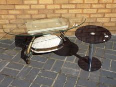 A good quality oval glass top coffee table,