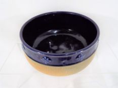 Royal Doulton - a Royal Doulton stoneware bowl with relief decoration,