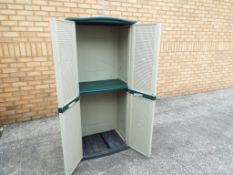 A plastic moulded tool shed,