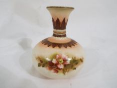 Royal Worcester - A small Hadley's bulbous vase with floral decoration, stamped to the base,