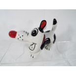 Lorna Bailey - a comical figurine depicting a dog, signed to the underside, 10.