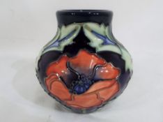 Moorcroft pottery - A small Moorcroft pottery bulbous vase decorated with the Poppy pattern,
