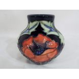 Moorcroft pottery - A small Moorcroft pottery bulbous vase decorated with the Poppy pattern,