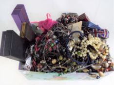 A box containing a large quantity of costume jewellery including some stamped 925,