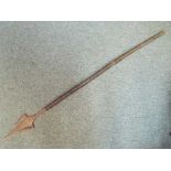 An African 3 pointed spear with dark wood shaft This lot MUST be paid for and collected,