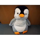 A very large soft toy penguin from the film 'Happy Feet',