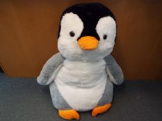 A very large soft toy penguin from the film 'Happy Feet',