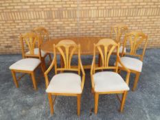 A dining table and 4 chairs and 2 carvers, height 76cm x 155cm extending to approx.