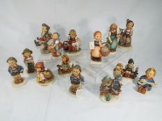Fifteen Goebel Hummel figurines predominantly depicting children with animals (15) This lot MUST be