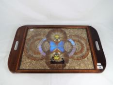 A Brazilian inlaid butterfly tray, inlaid to the border and butterfly wings centre,