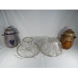 Two large Rumtopf lidded stoneware German pots and a pair of beaded lamp shades (4) This lot MUST