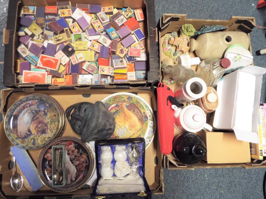 Three boxes containing a quantity of glassware, ceramics, ornamental cottages, foot warmer,