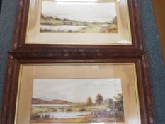 Two watercolours mounted and framed under glass in carved wooden frames depicting countryside