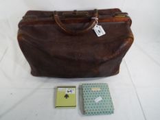 A Gladstone leather bag and a enamelled vintage powder compact marked Brevete S.G.D.