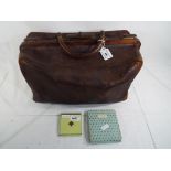 A Gladstone leather bag and a enamelled vintage powder compact marked Brevete S.G.D.