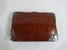 A leather two section cigar case with silver mounts, Birmingham assay 1896,