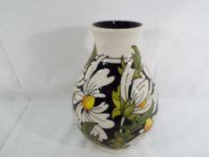 Moorcroft - a Moorcroft vase decorated in the Pheobe pattern, approximate height 19.5 cm (h).