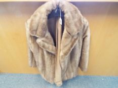 A good quality Astraka faux fur jacket UK size 16 with slip pockets,