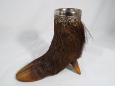 A spill pot in the form of a boar's foot, approximate height 12.5 cm (h).