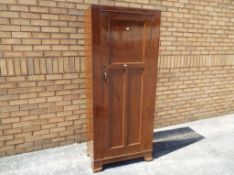 A mahogany single door hall robe approx 182cm x 76cm x 45cm This lot MUST be paid for and collected,