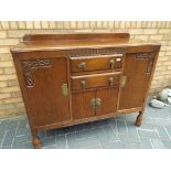 An early 20th century oak sideboard, 95