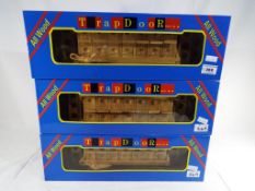 Three carved wooden novelty games entitl