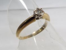 A 9 carat yellow gold diamond solitaire,